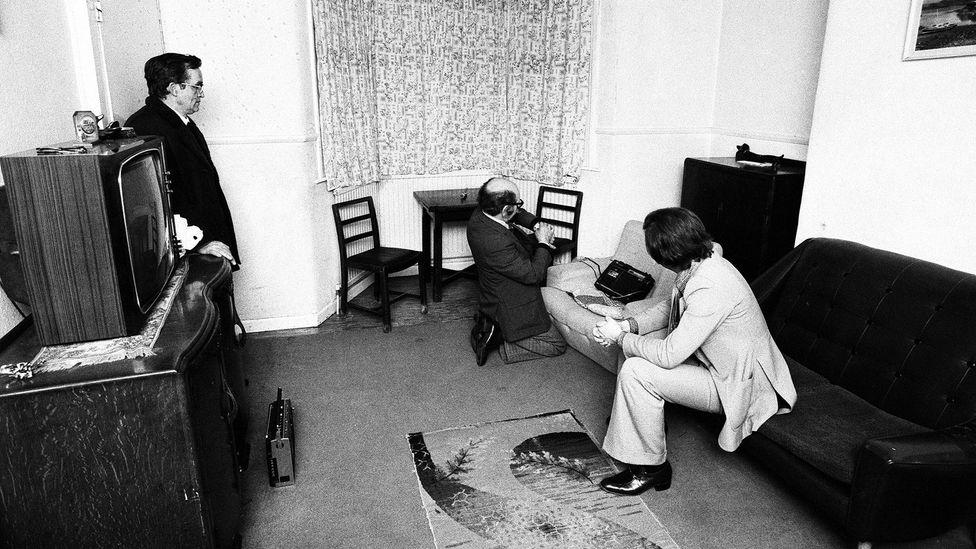 Paranormal investigator Maurice Grosse (pictured centre) spent months at the house, making audio recordings among other things (Credit: Alamy) Paranormal investigator Maurice Grosse (pictured centre) spent months at the house, making audio recordings among other things (Credit: Alamy)