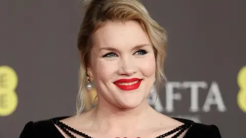 EPA Emerald Fennell smiling at the Bafta Awards 2024