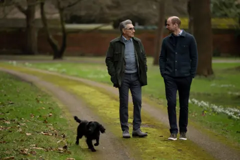 AppleTV+/PA Eugene Levy, Prince William and his dog walking in the park