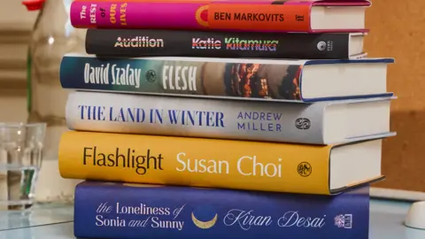 Yuki Sugiura/Booker Prize Foundation A stack of the six shortlisted books on a desk