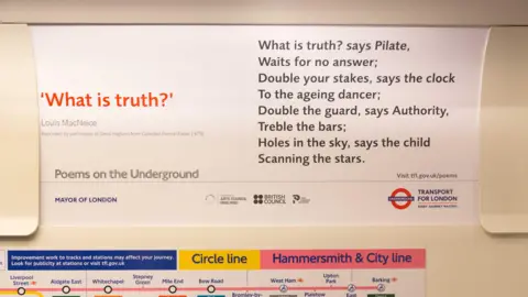 Transport for London A close up of a advertising card in a Tube carriage with poem printed on it called What is Truth? by Louis Macneice.